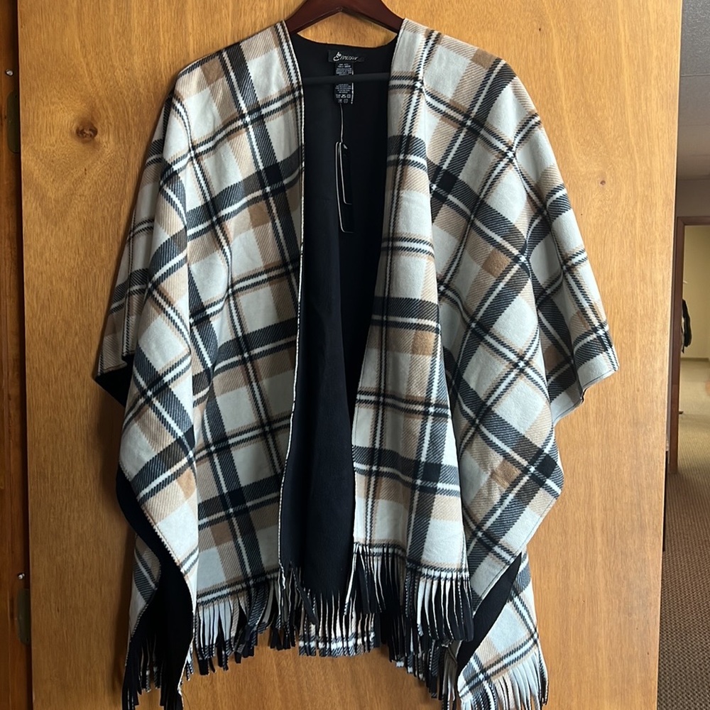 A multicolored throw. Never used. Smoke free home. Tags still attached.